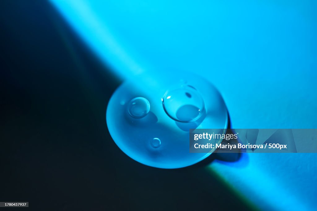 Close-up of blue fidget spinner against black background