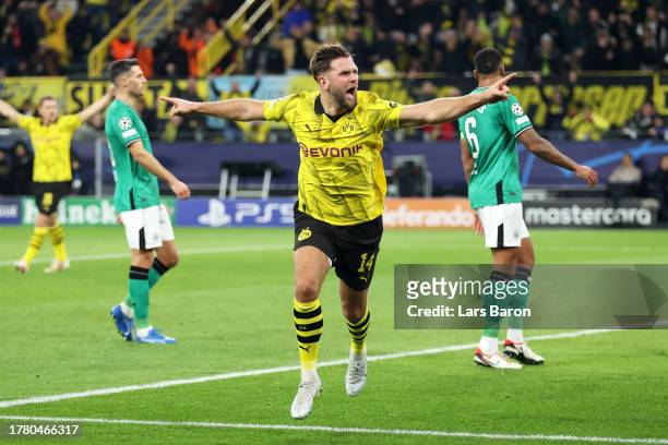 Niclas Fuellkrug of Borussia Dortmund celebrates after scoring the team's first goal during the UEFA Champions League match between Borussia Dortmund...