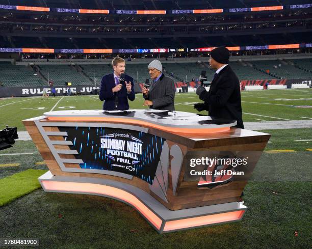 Commentators Jac Collinsworth, Tony Dungy and Rodney Harrison sit at the Sunday Night Football desk following a NFL football game between the Buffalo...