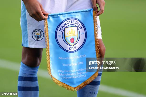 Detailed view of the Manchester City match pennant is seen being held prior to the UEFA Youth League 2023/24 match between Manchester City and Young...