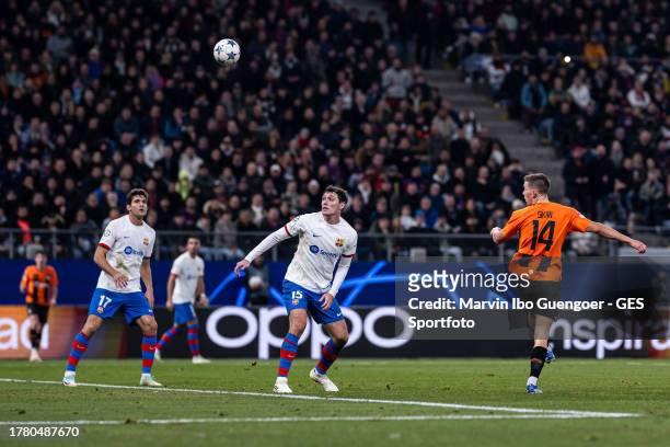 Danylo Sikan of Donezk scores his team's first goal with a header against Andreas Christensen and Marcos Alonso of Barcelona during the UEFA...