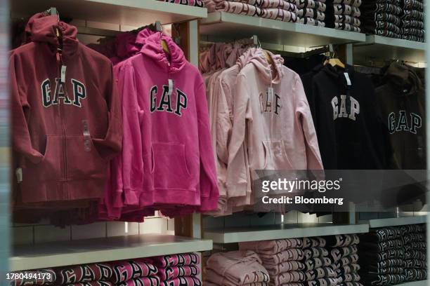 Sweatshirts inside a Gap store in the Times Square neighborhood of New York, US, on Monday, Nov. 13, 2023. US holiday sales will grow at a slower...