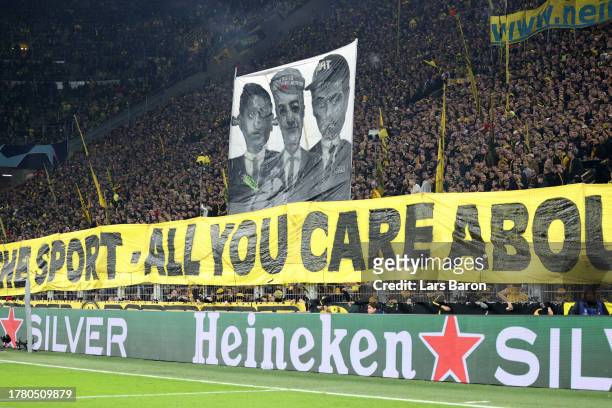 Borussia Dortmund fans hold up a banner during the UEFA Champions League match between Borussia Dortmund and Newcastle United at Signal Iduna Park on...