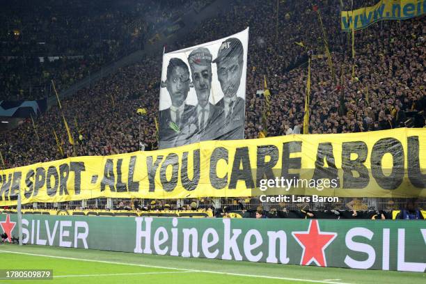 Borussia Dortmund fans hold up a banner during the UEFA Champions League match between Borussia Dortmund and Newcastle United at Signal Iduna Park on...