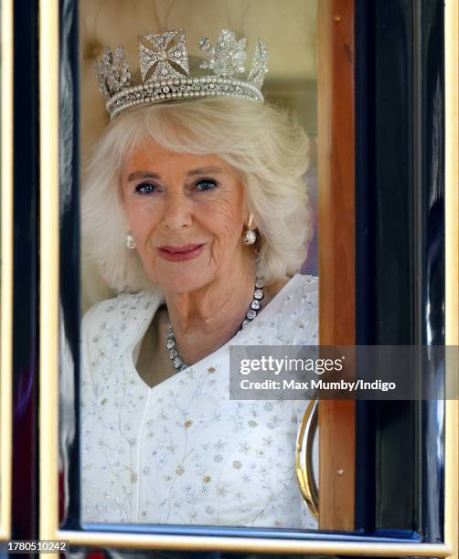 Queen Camilla travels down The Mall in the Diamond Jubilee State Coach, from Buckingham Palace to the Houses of Parliament, to attend The State...