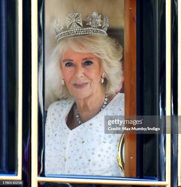 Queen Camilla travels down The Mall in the Diamond Jubilee State Coach, from Buckingham Palace to the Houses of Parliament, to attend The State...