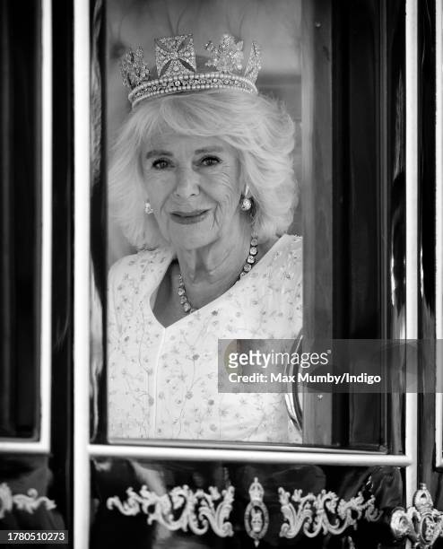 Queen Camilla travels down The Mall in the Diamond Jubilee State Coach, from Buckingham Palace to the Houses of Parliament, to attend The State...