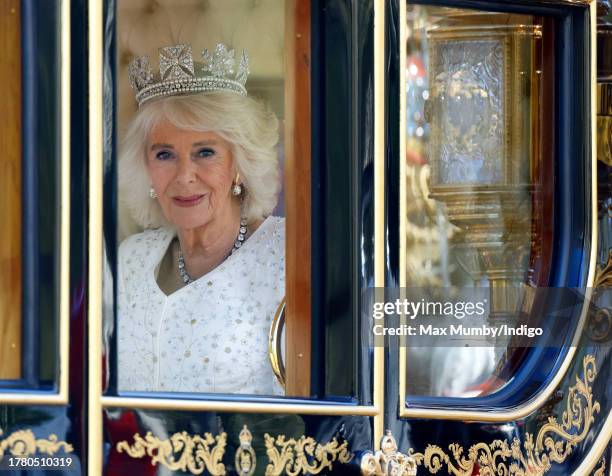 Queen Camilla travels down The Mall in the Diamond Jubilee State Coach, from Buckingham Palace to the Houses of Parliament, to attend The State...