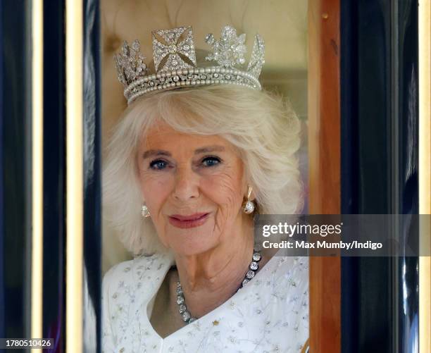 Queen Camilla travels down The Mall in the Diamond Jubilee State Coach, from Buckingham Palace to the Houses of Parliament, to attend The State...