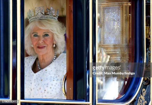 Queen Camilla travels down The Mall in the Diamond Jubilee State Coach, from Buckingham Palace to the Houses of Parliament, to attend The State...