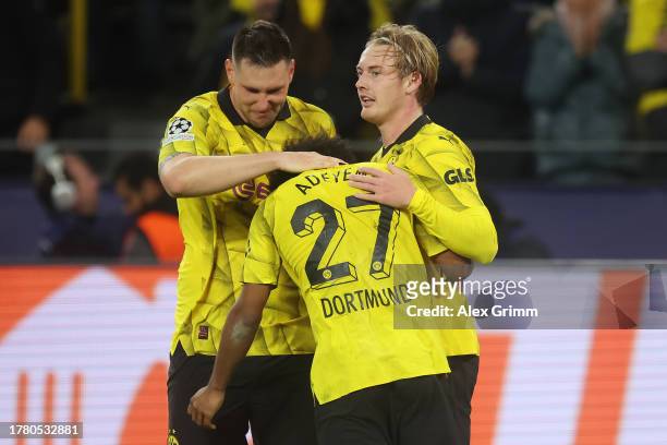 Julian Brandt of Borussia Dortmund celebrates with teammates after scoring the team's second goal during the UEFA Champions League match between...