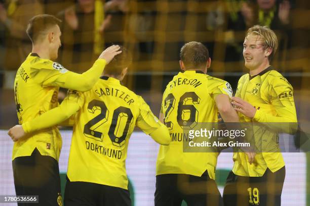 Julian Brandt of Borussia Dortmund celebrates with teammates Nico Schlotterbeck , Marcel Sabitzer and Julian Ryerson after scoring the team's second...