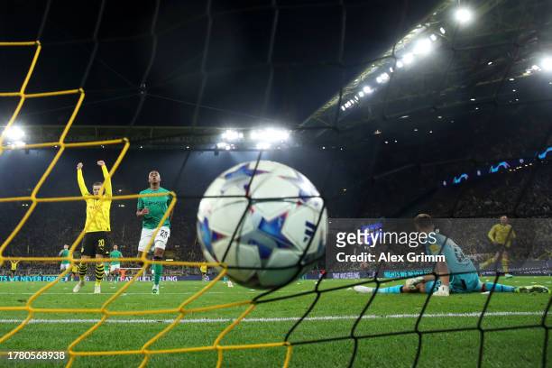 Nick Pope of Newcastle United fails to save a shot from Julian Brandt of Borussia Dortmund as he scores the side's second goal during the UEFA...