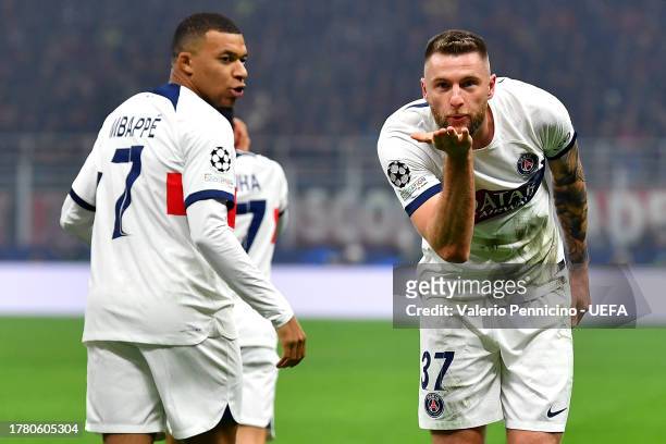 Milan Skriniar of Paris Saint-Germain celebrates alongside teammate Kylian Mbappe after scoring the team's first goal during the UEFA Champions...