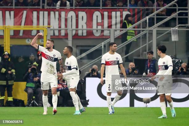 Milan Skriniar of Paris Saint-Germain celebrates alongside teammate Kylian Mbappe after scoring the team's first goal during the UEFA Champions...