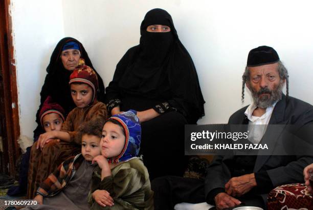 Yussuf , the father of a Yemeni Jew Masha Yaeish al-Nahari killed earlier this month, sits at his home with his daughter , wife and his son's...