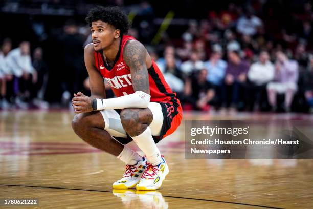 Houston Rockets guard Jalen Green pauses on the court during a Sacramento Kings free throw during the second half on an NBA basketball game on...
