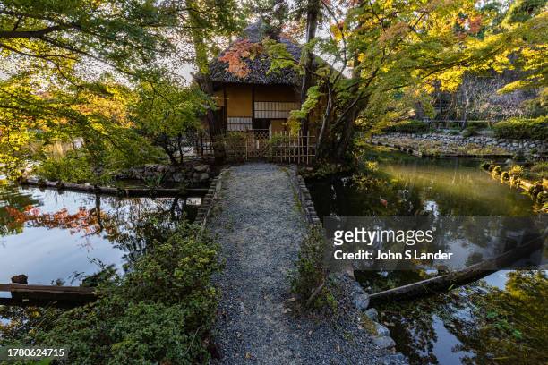 Teahouse at Umenomiya Taisha Shrine Garden - yet another one of Kyoto's hidden gems. This large pond garden, Umenomiya Taisha shows a variety of...