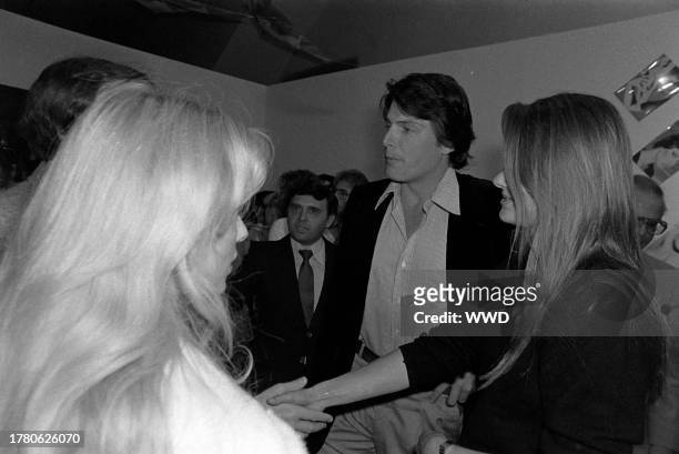 Christopher Reeve and Gae Exton attend a party at the E.C. Windward Gallery in Venice, California, on May 15, 1980.