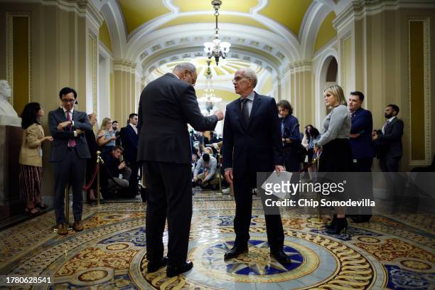 Senate Majority Leader Charles Schumer talks to Sen. Peter Welch during a news conference following the weekly Senate Democratic policy luncheon at...