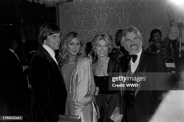 Bruce Jenner, Linda Thompson, Marianne Gordon, and Kenny Rogers attend a party, benefitting the development of a medical center at Israel's...