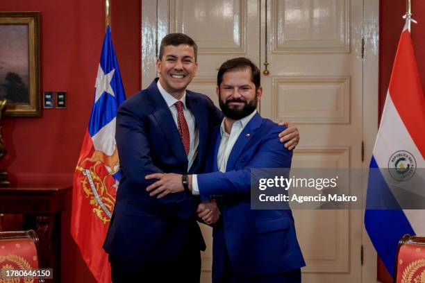 President of Chile Gabriel Boric and President of Paraguay Santiago Peña shake hands in front of the press before starting a work meeting during an...