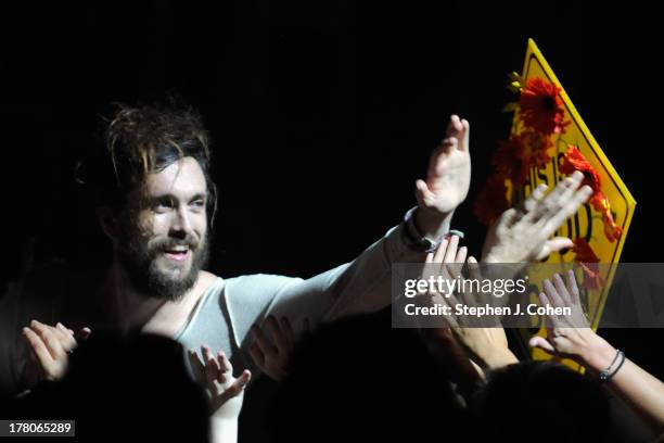 Alex Ebert of Edward Sharpe And The Magnetic Zeros performs at Iroquois Amphitheater on August 26, 2013 in Louisville, Kentucky.