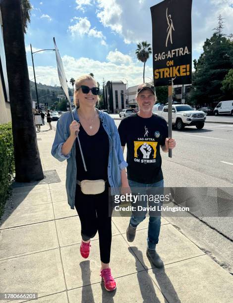 Kristen Johnston and Sam Trammell join the picket line outside Warner Bros. Studios on November 07, 2023 in Burbank, California. SAG-AFTRA has been...