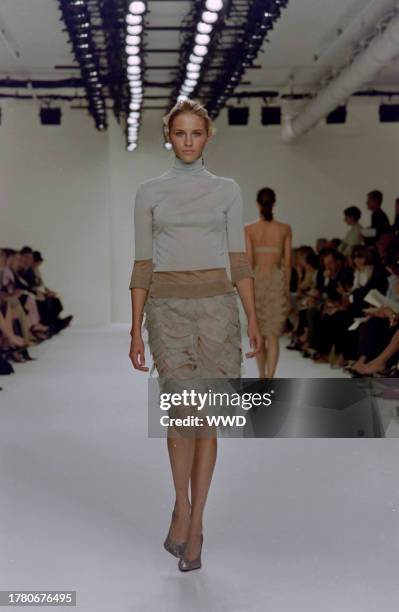 This is the first collection designed by Francisco Costa following Calvin Klein's departure from his eponymous label in the fall of 2003. Model Sara...