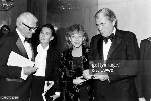 Cary Grant, Barbara Harris, Veronique Peck, and Gregory Peck attend a benefit performance at the Los Angeles Music Center in Los Angeles, California,...