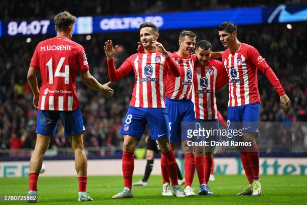 Saul Niguez of Atletico Madrid celebrates with teammates after scoring the team's sixth goal during the UEFA Champions League match between Atletico...