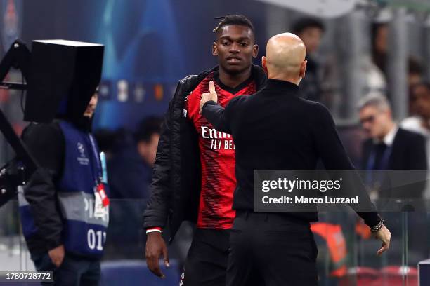 Rafael Leao of AC Milan is embraced by Head Coach Stefano Pioli after he is substituted during the UEFA Champions League match between AC Milan and...