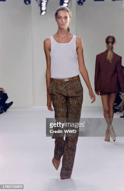 This is the first collection designed by Francisco Costa following Calvin Klein's departure from his eponymous label in the fall of 2003. Model Daria...