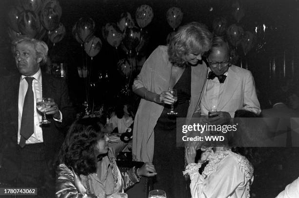 Adolph Green, Amanda Green, Alexandra Schlesinger, Arthur M. Schlesinger Jr., and Phyllis Newman attend a party, celebrating the opening of "The...