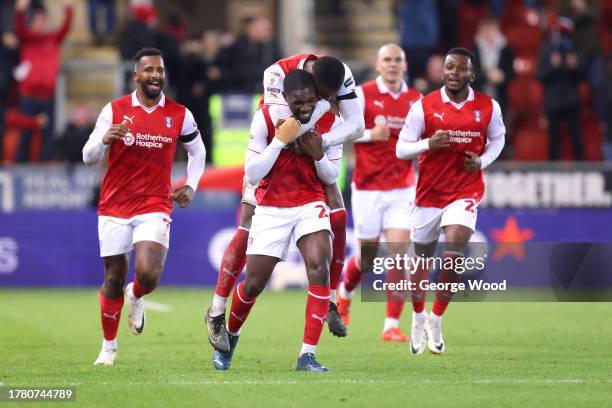 Christ Tiehi of Rotherham United celebrates with teammates after scoring the team's second goal during the Sky Bet Championship match between...