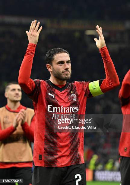 Davide Calabria of AC Milan celebrates the win at the end of the UEFA Champions League match between AC Milan and Paris Saint-Germain at Stadio...