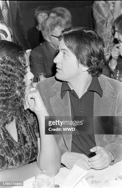 Diahnne Abbott and Robert De Niro attend an awards ceremony at Sardi's in New York City on January 30, 1977.