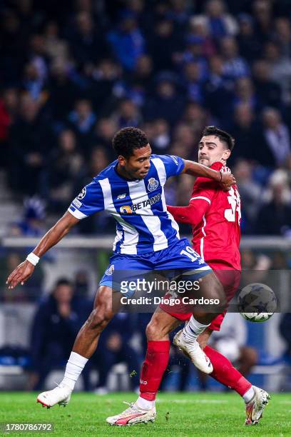 Danny Namaso of FC Porto and Jelle Bataille of Royal Antwerp FC battle for the ball during the UEFA Champions League match between FC Porto and Royal...