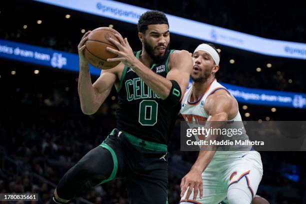 Jayson Tatum of the Boston Celtics rebounds the ball during the second quarter against the New York Knicks at TD Garden on November 13, 2023 in...