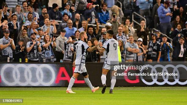 Johnny Russell and Alan Pulido of Sporting Kansas City celebrate Johnnys first goal of the evening during the first half during a game between...