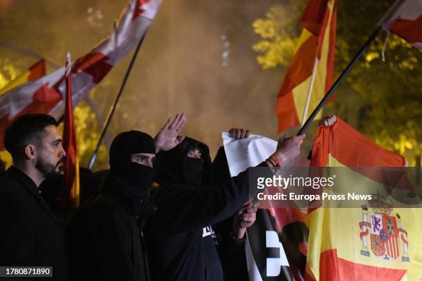 Dozens of demonstrators with flags confront the police during a rally against the amnesty, in front of the PSOE headquarters in Ferraz street, on...