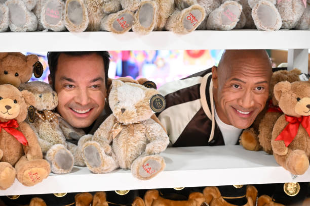 Episode 1874 -- Pictured: Host Jimmy Fallon and actor Dwayne Johnson during the FAO Schwarz Surprise Giveaway on Monday, November 13, 2023 --