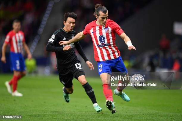 Caglar Soyuncu of Atletico Madrid takes on Yang Hyun-Jun of Celtic during the UEFA Champions League match between Atletico Madrid and Celtic FC at...