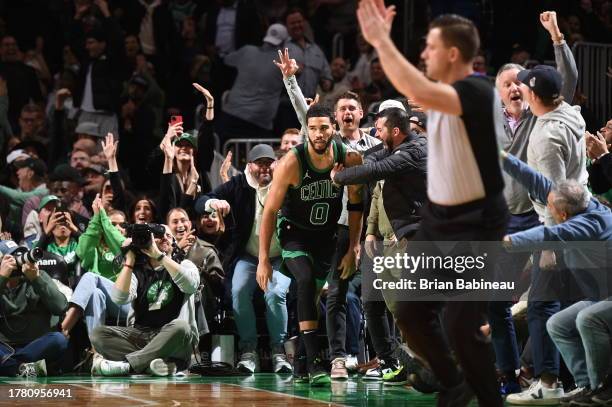 Jayson Tatum of the Boston Celtics celebrates a three point basket during the game against the New York Knicks on November 13, 2023 at the TD Garden...