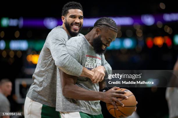 Jayson Tatum of the Boston Celtics reacts with Jaylen Brown of the Boston Celtics before a game against the New York Knicks at TD Garden on November...