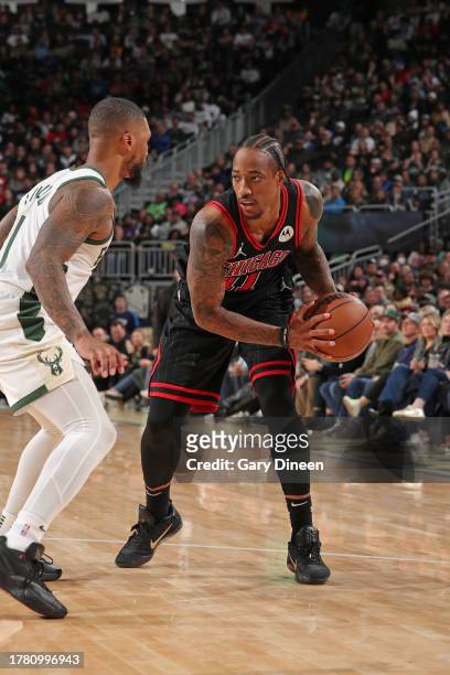 DeMar DeRozan of the Chicago Bulls handles the ball during the game against the Milwaukee Bucks on November 13, 2023 at the Fiserv Forum in...
