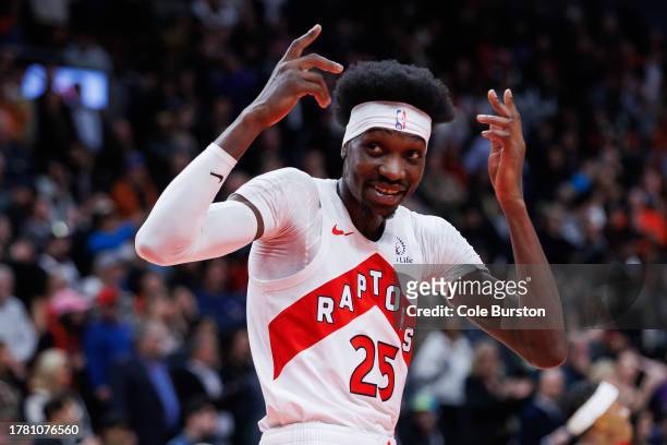 Chris Boucher of the Toronto Raptors reacts to the fans after scoring the game-tying basket against the Washington Wizards during the second half of...