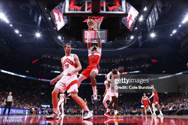 Daniel Gafford of the Washington Wizards dunks against Jakob Poeltl of the Toronto Raptors during the first half of their NBA game at Scotiabank...