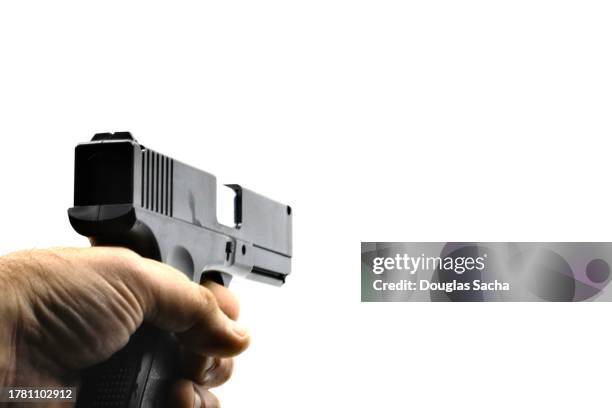 aiming a firearm at the target - firing squad stock pictures, royalty-free photos & images
