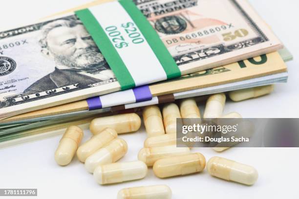 high cost of medication concept - ten us dollar note stock pictures, royalty-free photos & images